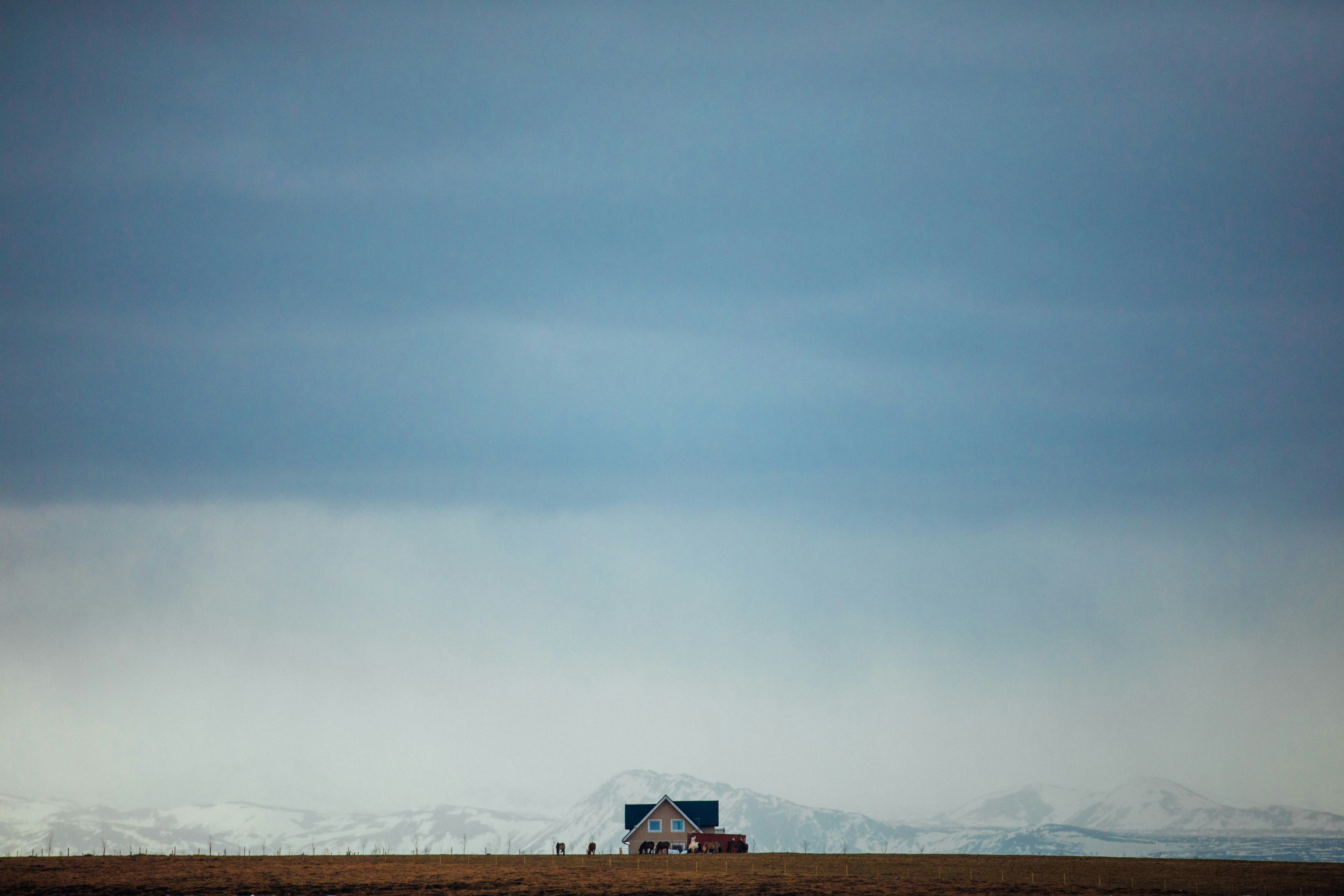 panoramic photography of house near mountain alps